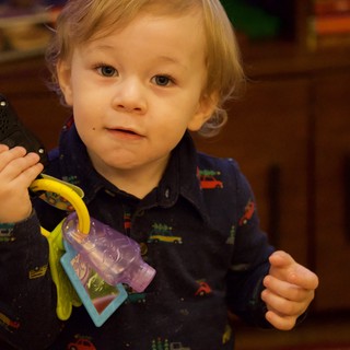 Toddler Playing with Phone and Keys at Christmas Time