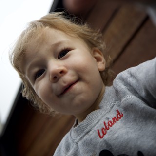 Joyful Toddler in Parent's Arms at Home
