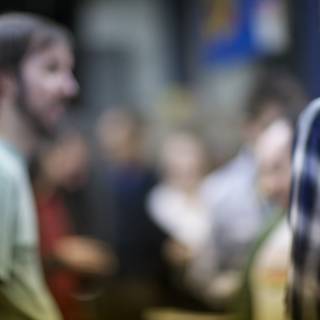 Blurred Beard in a Crowded Cafeteria