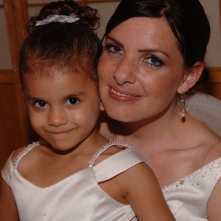 Bride and Flower Girl Share a Sweet Wedding Moment
