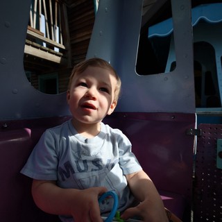 Toddler Enjoying a Sunny Day at Fantasyland Playground