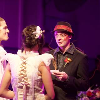 Hat-Wearing Man Chats with Two Women at 2011 Wickstrom Wedding