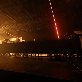 Red Laser Slices Through Smoky EDM Festival Stage