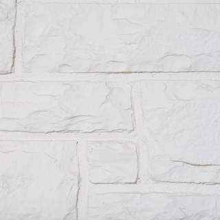 White Stone Wall with Intricate Brick Pattern