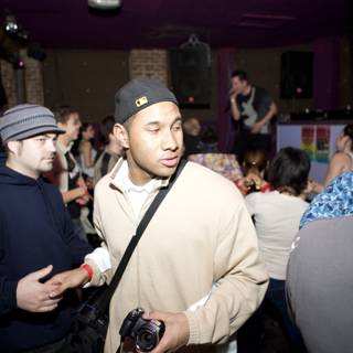 Hat-wearing Man in a Jam-Packed Nightclub