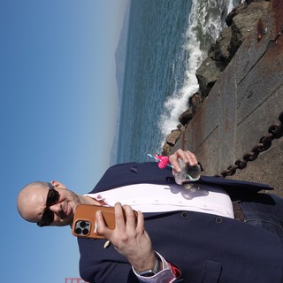 Business Professional Taking Seaside Selfie with Drink