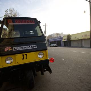 Small Yellow and Black Automobile on a Cloudy Day