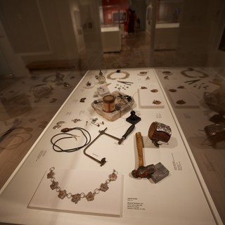Museum Display Case with Historical Artifacts and Jewelry