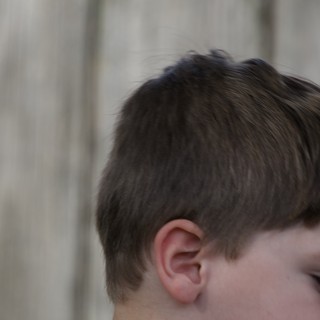 Profile Portrait of Young Boy with Brown Hair