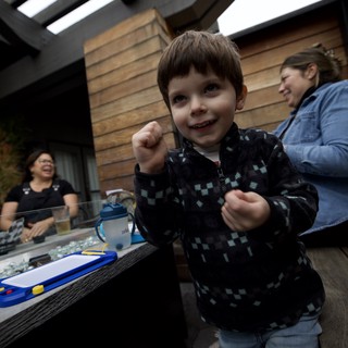 Joyful Child at Outdoor Patio Gathering