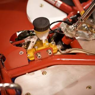 The Engine of a Red and White Motorcycle