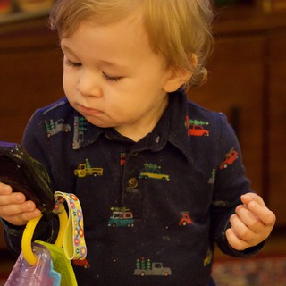Toddler Exploring Smartphone During Christmas Time