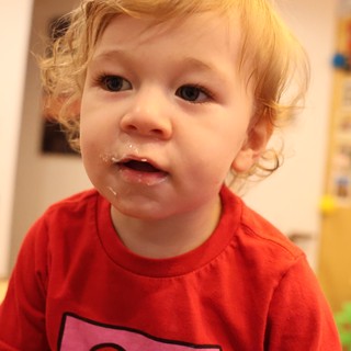 Toddler in Red Shirt After Christmas Meal