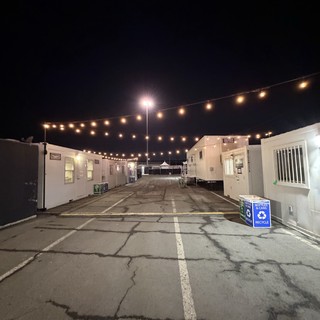 Empty Event Venue Pathway at Night with String Lights