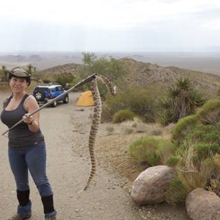 A Teen Girl Tames the Wild: Holding a Snake in the Desert