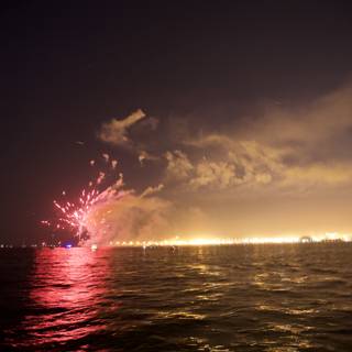 A Flare of Fireworks on the Water at Night