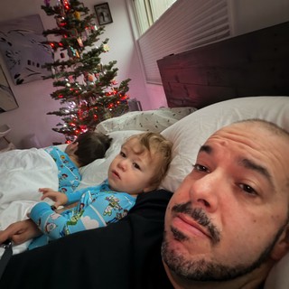 Father and Child Christmas Morning in Bedroom