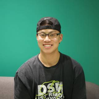 Smiling Teen in his Black Hat and Shirt