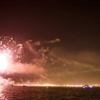 Fireworks Illuminating the Night Sky over the Water
