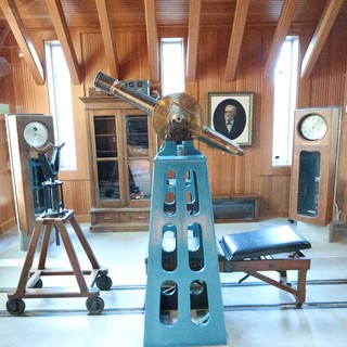 Vintage Astronomical Observatory Interior with Historic Telescope