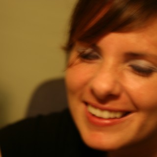 Candid Smile: Woman Lost in a Warm Moment