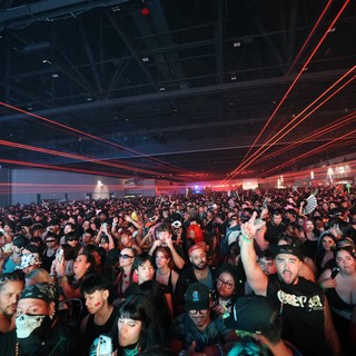 Red Laser Light Show Over Massive Rave Crowd