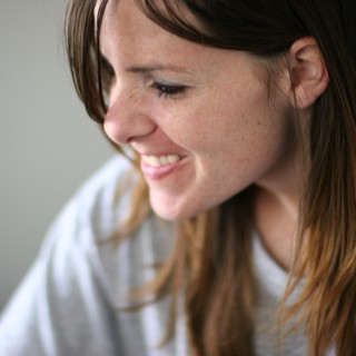 Candid Smile of a Young Woman Lost in Thought