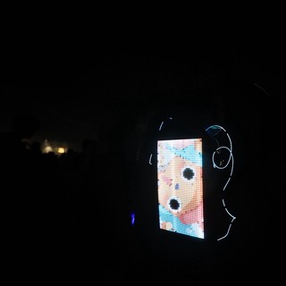 LED Face Display Glows in Dark Festival Night