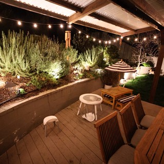 Cozy Backyard Patio with String Lights at Night