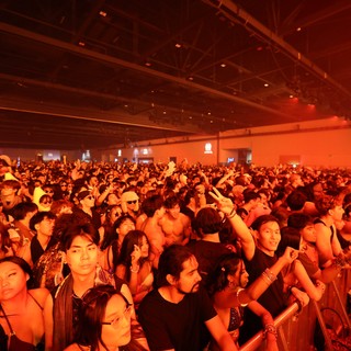 Massive Indoor Crowd Bathed in Red Light