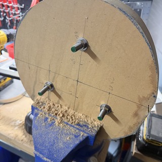 Cardboard Disc Mounted in Workshop Vice for DIY Project