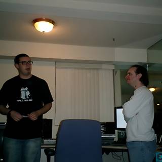 Two Men Discussing in a Well-Equipped Room