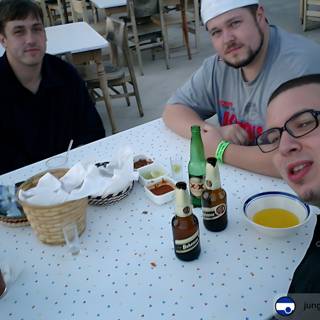 Three Men Enjoying a Beer at a Restaurant in 2003