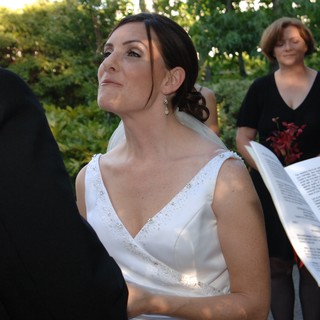 Bride's Emotional Gaze During Outdoor Wedding Ceremony