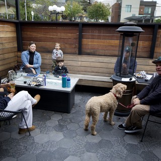 Family Gathering on Dog-Friendly Restaurant Patio