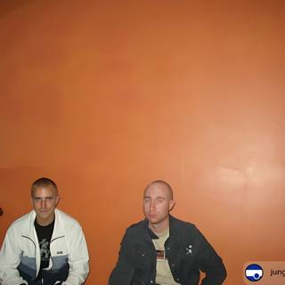 Relaxing in Front of an Orange Wall