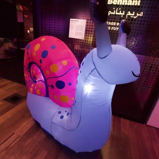 Colorful Inflatable Snail Art Installation at Museum