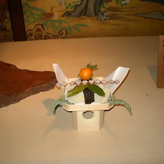 Paper Flower and Orange on Dining Table