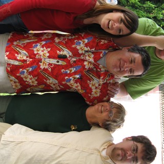 Five Family Members Celebrate Christmas Together Indoors