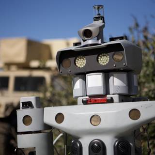 Robot guarding military vehicle