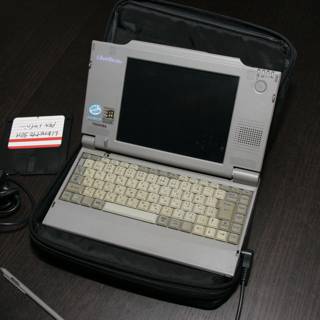 Vintage Laptop Computer with Accessories