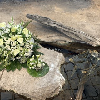 Memorial Flower Arrangement by Tranquil Water Feature
