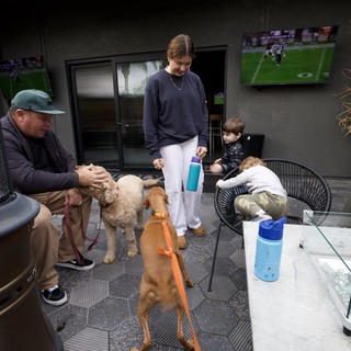 Family Patio Gathering with Dogs and Football