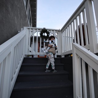 Children Embracing on Outdoor Stairway at Dusk