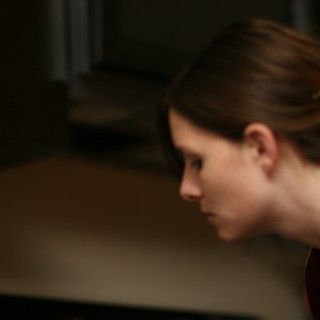 Young Woman in Focused Concentration, Side Profile