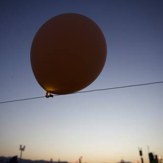 Sunset Silhouette with a Giant Balloon at Coachella 2024