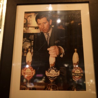 Prince Charles Behind the Bar at British Pub