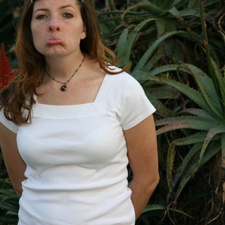 Young Woman Making Pouty Face in Desert Garden