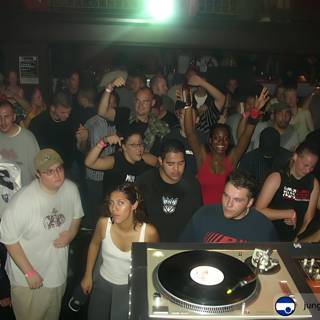 Nightclub Crowd Enjoys DJ Performance