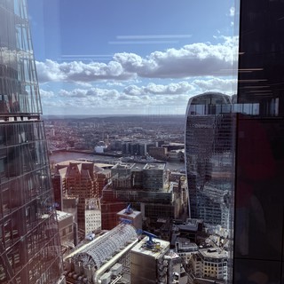 Aerial View of London's Financial District Under Dramatic Skies